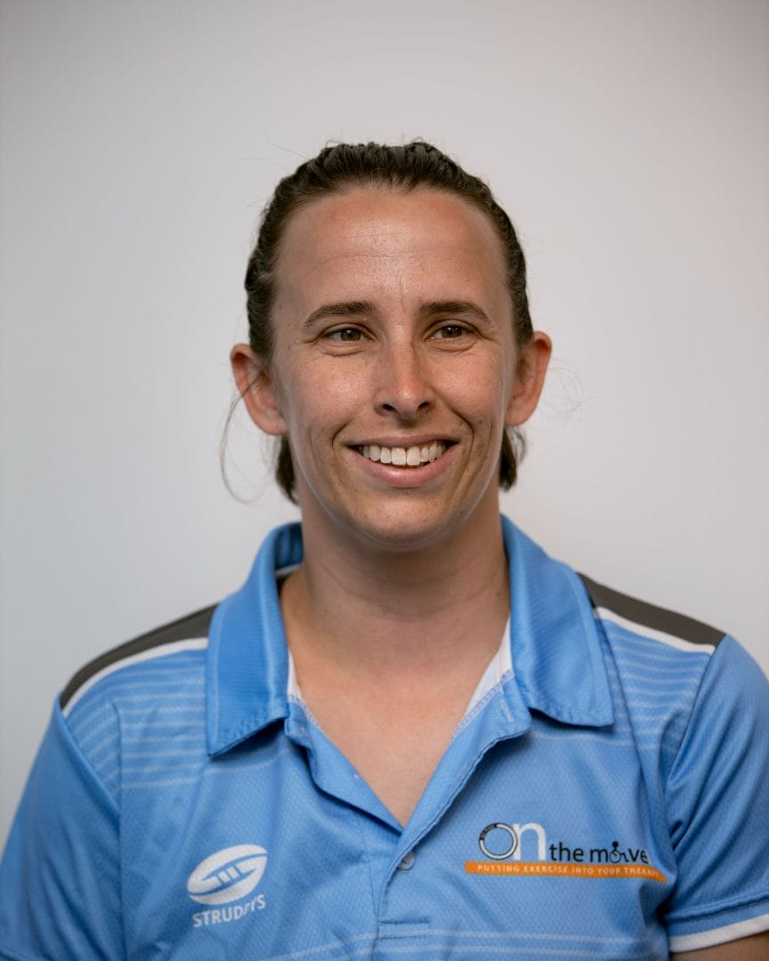 Rebecca O’Donnell in a blue shirt smiling.